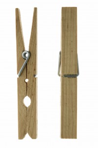 Two isolated wooden clothespins