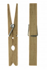 Two isolated wooden clothespins